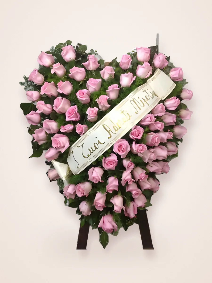 Heart of pink roses with a dedication ribbon