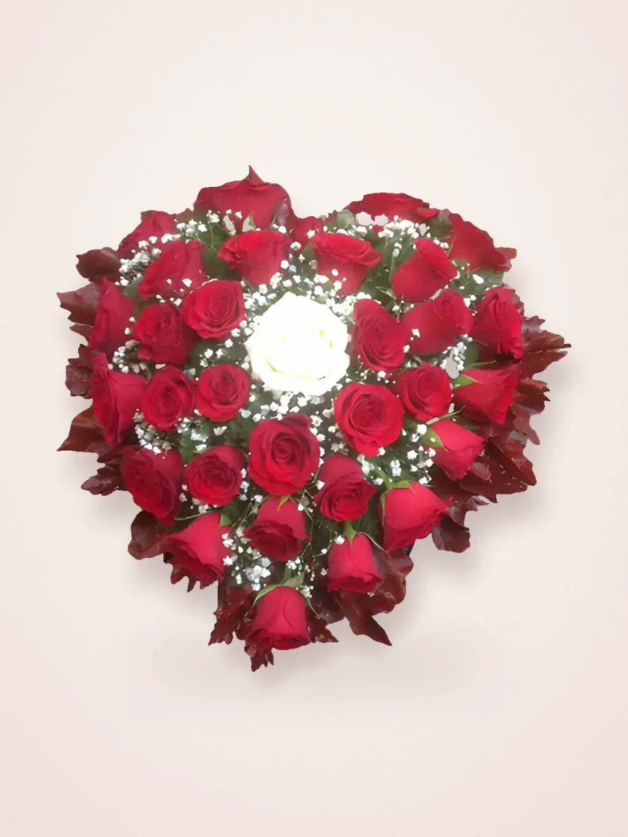 Heart of red roses with a white centre